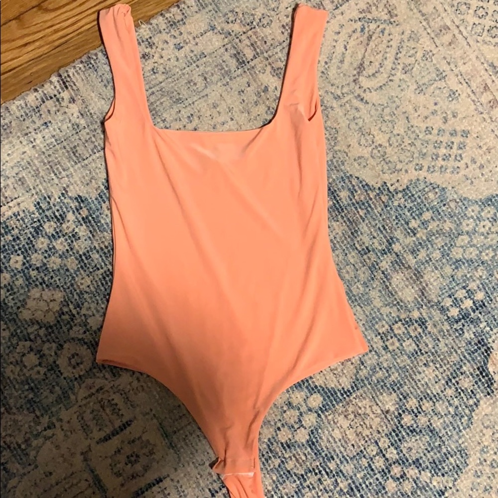 Light neon orange bodysuit